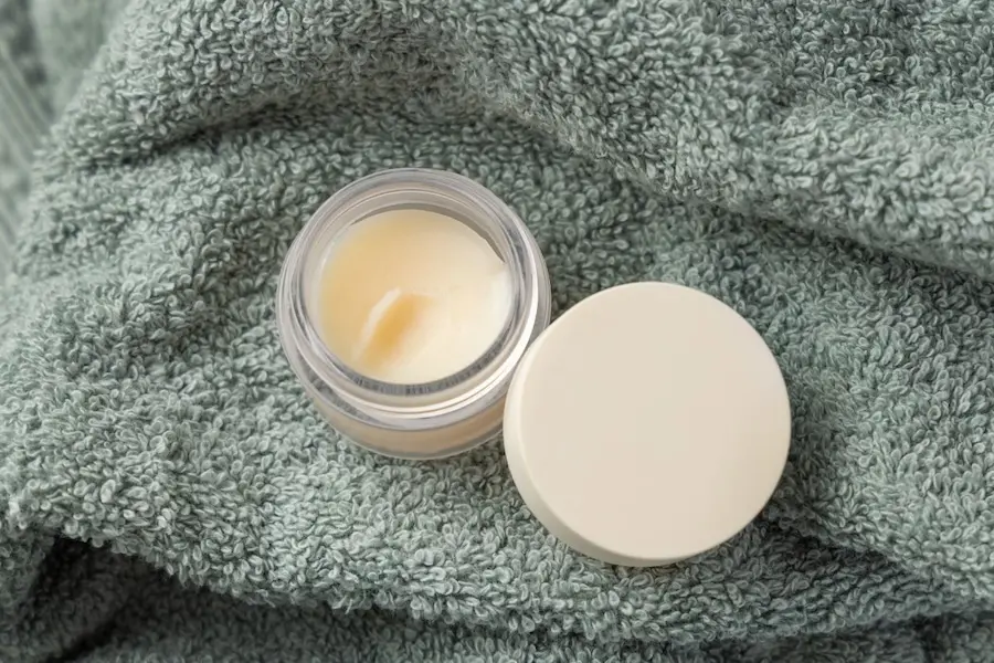 A gentle soothing balm on a textured towel, used to manage surface changes and dryness while waiting for russian lips to heal.