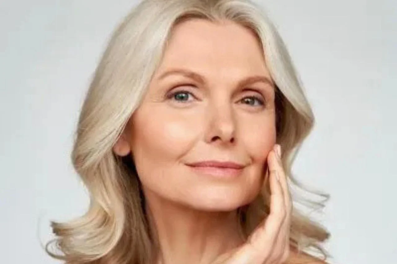Woman touching her face noticing subtle changes in facial volume loss over time