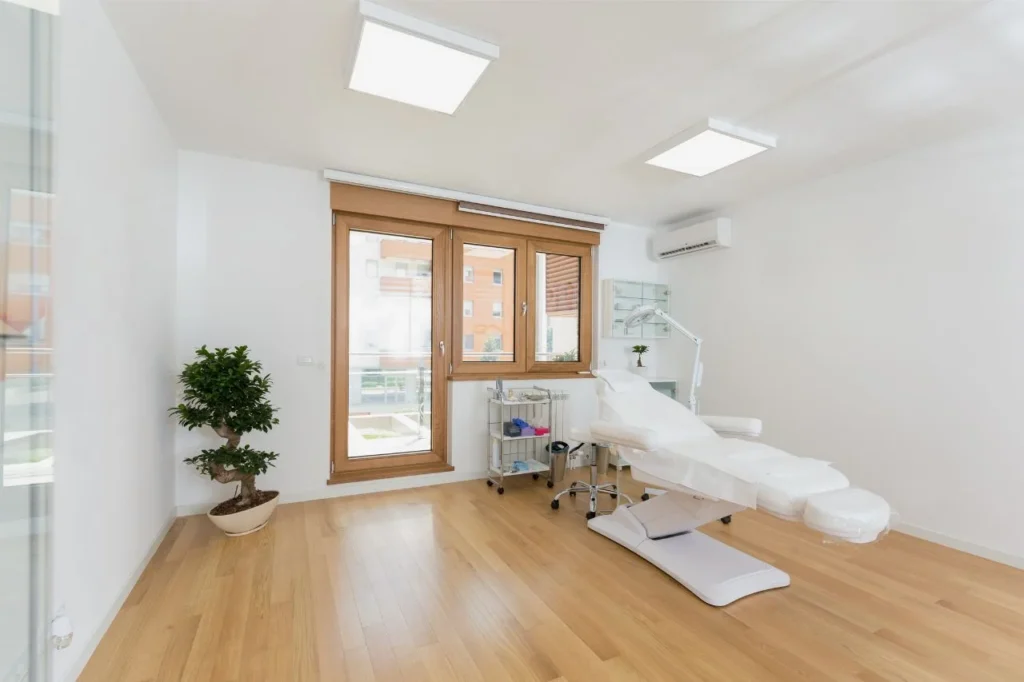 Clean cosmetic clinic treatment room for professional facial volume loss treatment options.