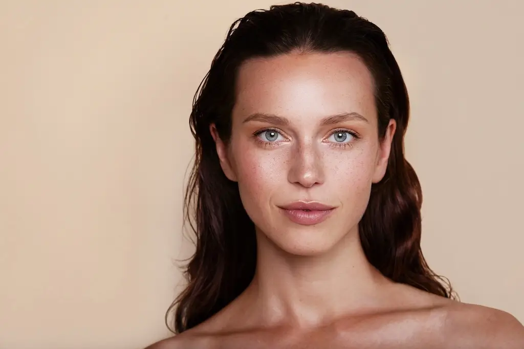 Portrait of a woman with clear, radiant skin following fractional CO2 laser resurfacing treatment at Luxe Lips.