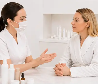 Skin professional answering client questions during a consultation for Picosure laser packages