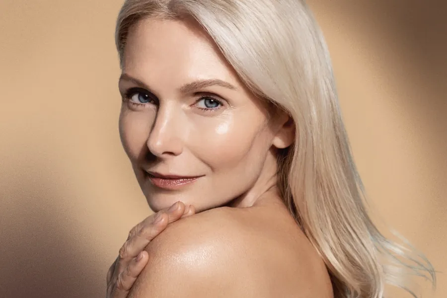 Woman with smooth glowing skin after professional cosmetic treatments Melbourne, showcasing natural-looking facial rejuvenation results