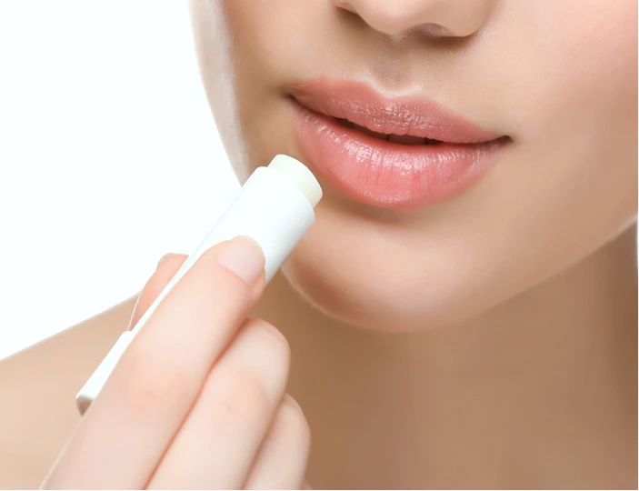 Close-up of hydrated lips with balm applied, representing preparation and care for lip filler treatment