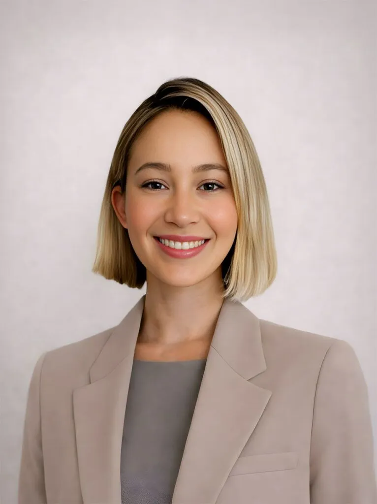 Portrait of Nurse Isabella from Luxe Lips Cosmetic Clinic in Melbourne smiling in a clinical setting