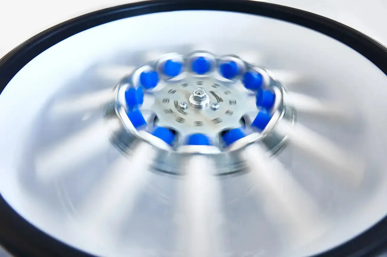 Medical centrifuge spinning blood samples to separate platelets, demonstrating what is PRP treatment and how platelet-rich plasma is prepared for regenerative aesthetic procedures