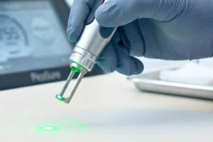 A close-up of a technician performing a treatment to demonstrate what is picosure laser and how the handpiece works.