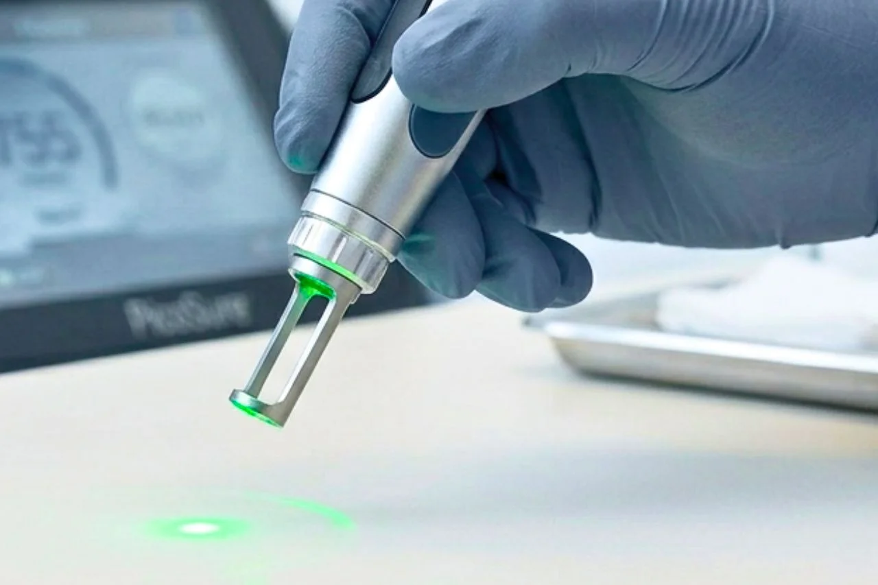 A close-up of a technician performing a treatment to demonstrate what is picosure laser and how the handpiece works.