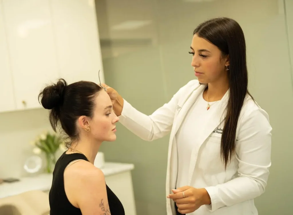 Medical practitioner performing a facial thread consultation on a client at Luxe Lips in Melbourne