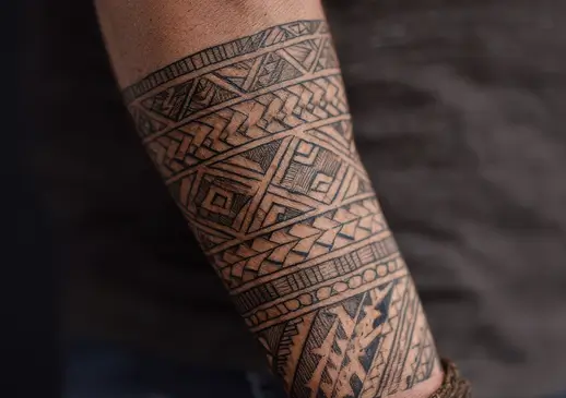 Geometric band tattoo on a man's lower leg before laser tattoo removal